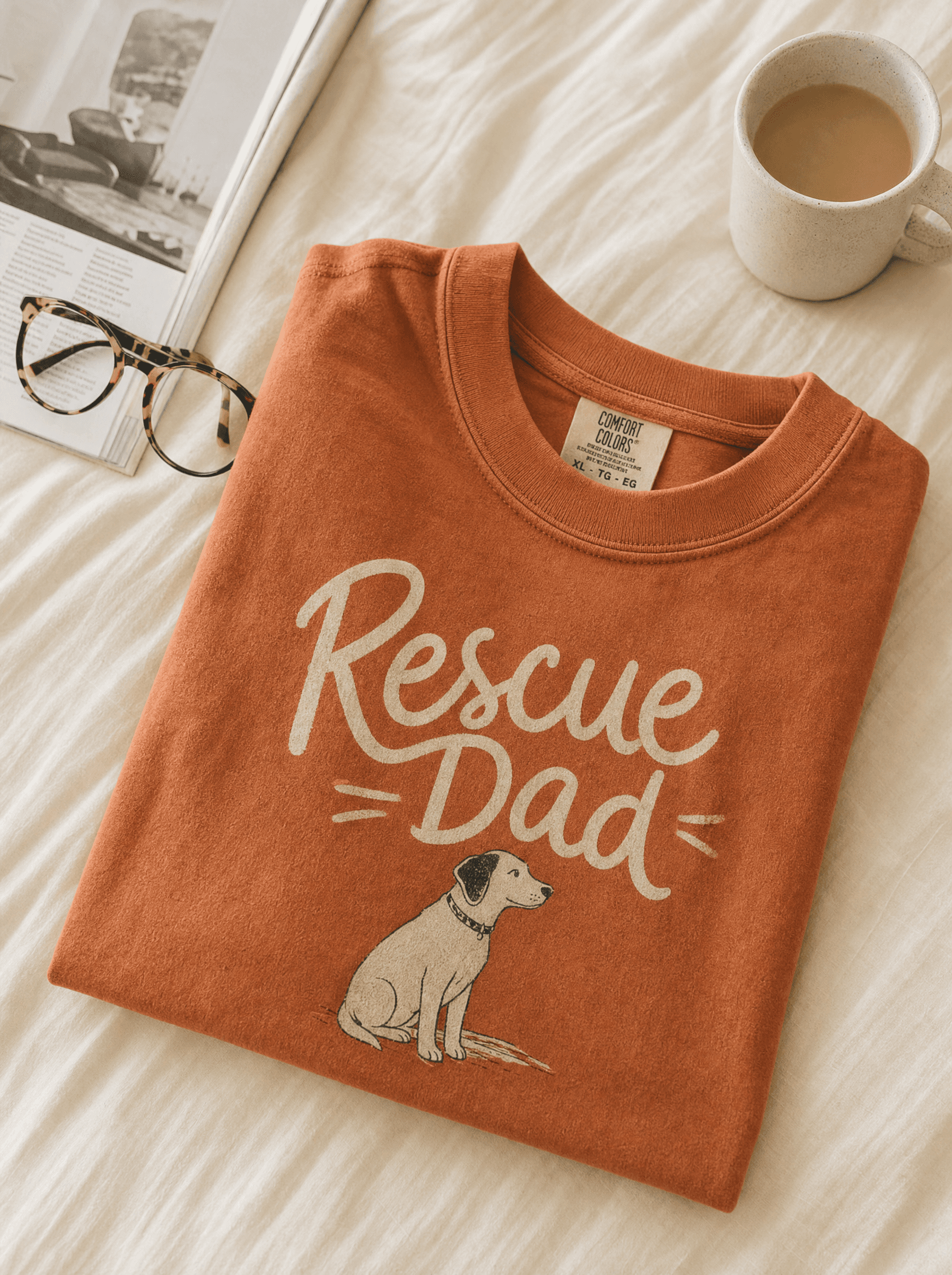 Heavyweight terracotta tee with 'Rescue Dad' typography and illustrated dog