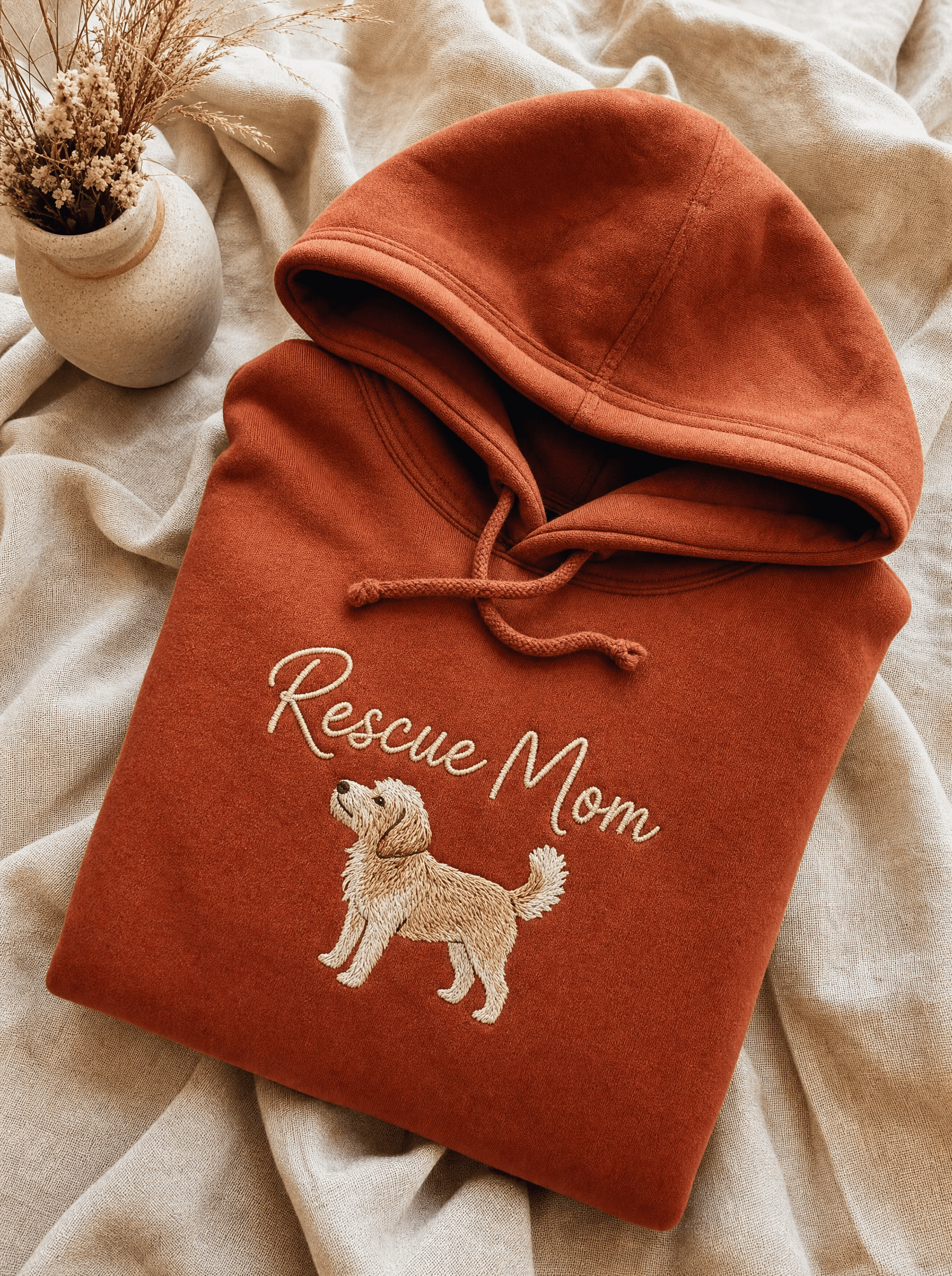 Heavy terracotta fleece hoodie with embroidered 'Rescue Mom' and small dog illustration